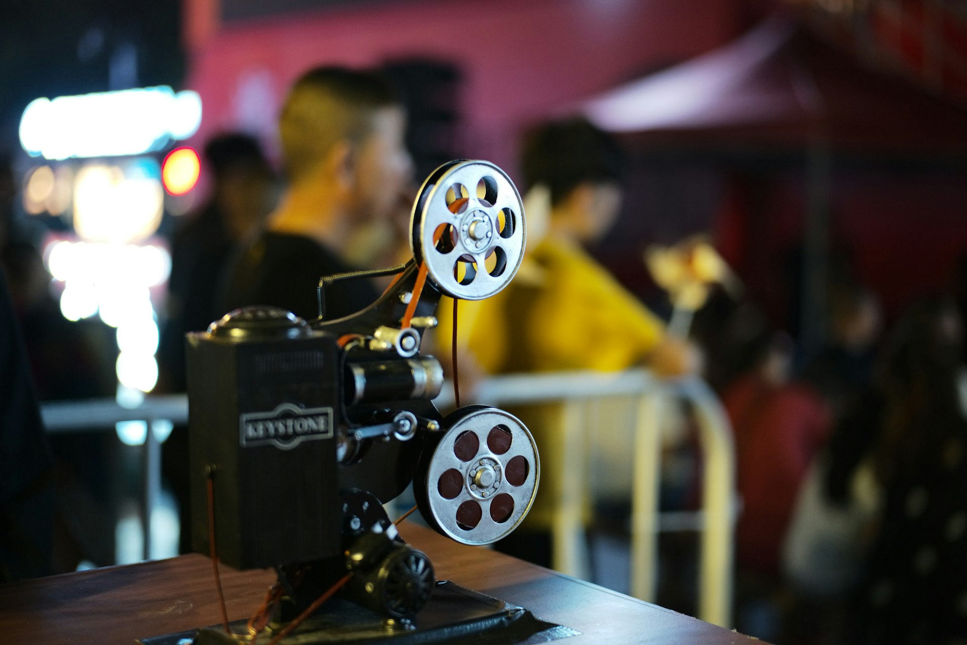 Vintage film projector on a table with blurred background